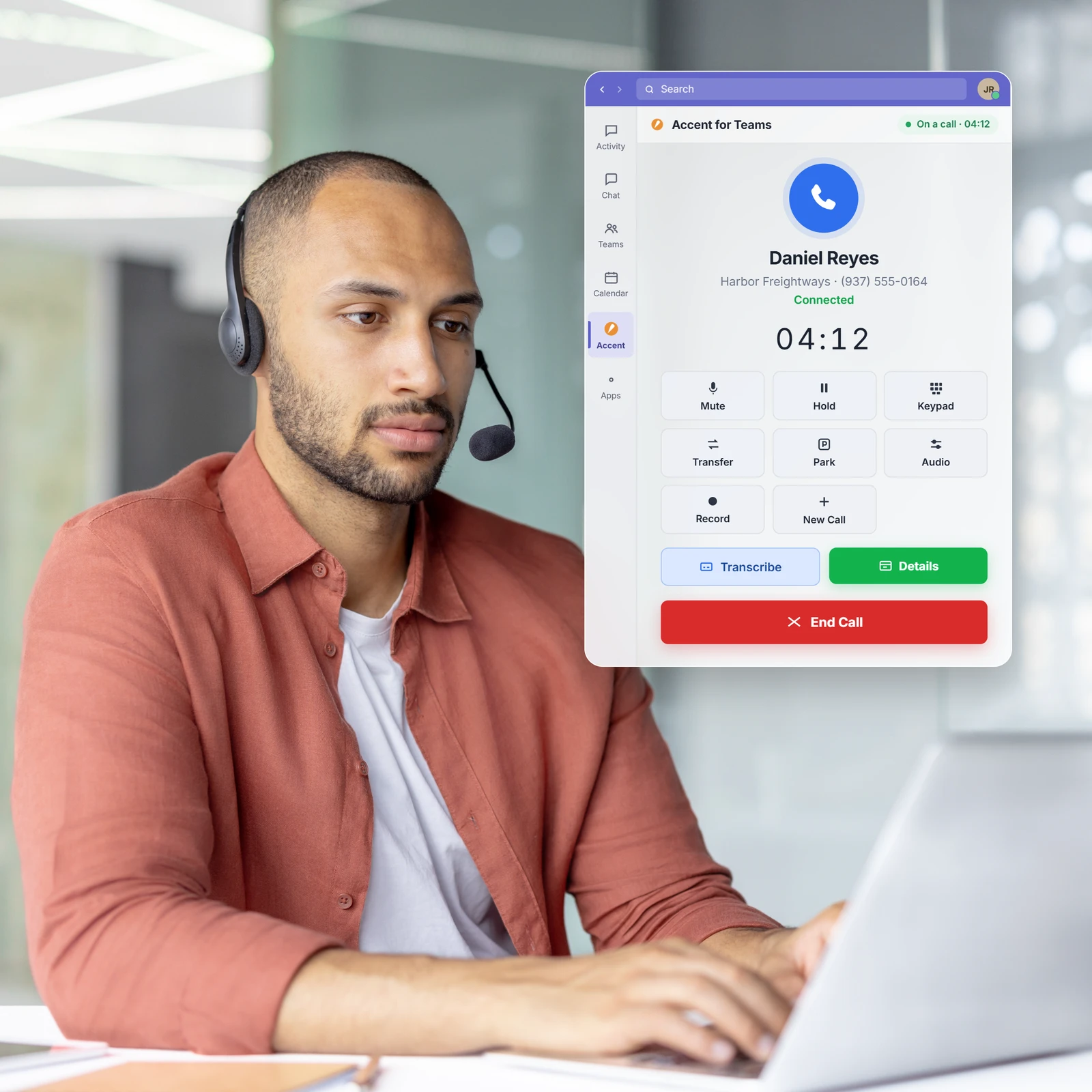 Man at a laptop next to an Accent for Teams active call