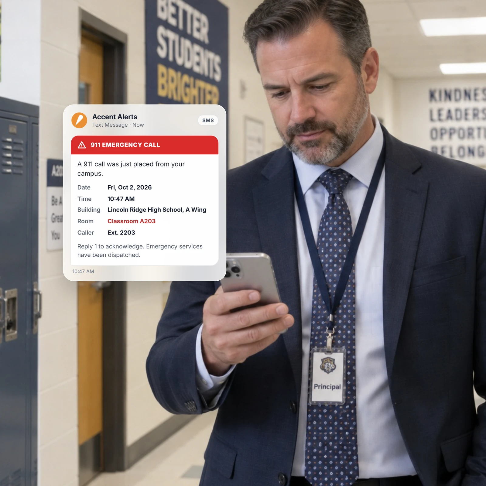 School administrator reading a 911 emergency alert on a phone in a hallway
