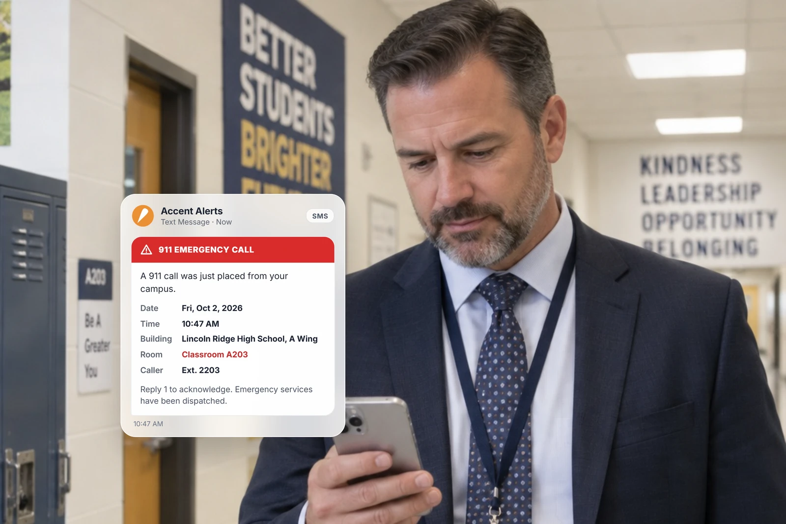 School administrator reading a 911 emergency alert on a phone in a hallway