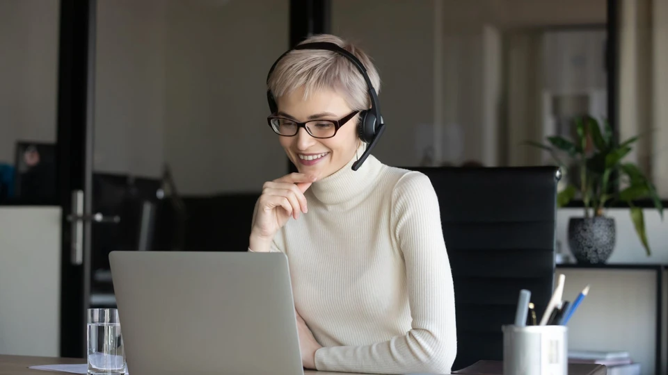 Friendly contact center agent wearing professional headset