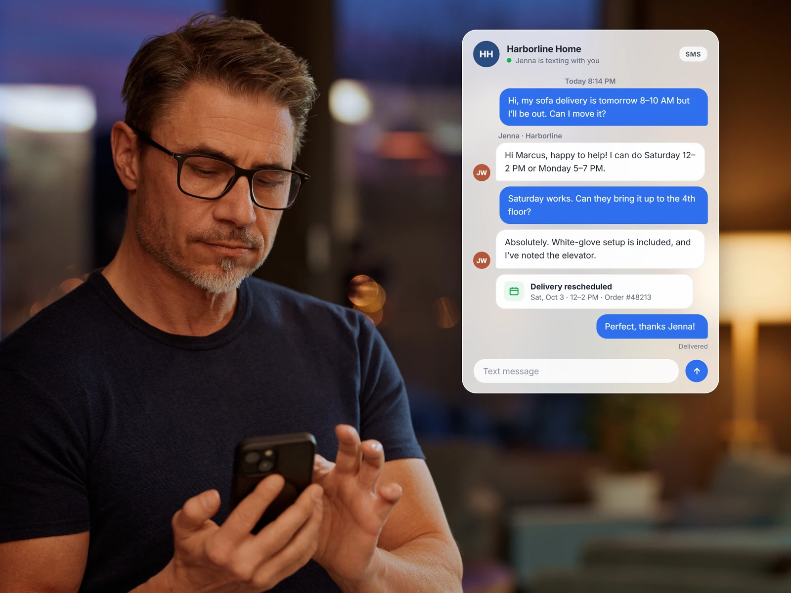 Man reading a text thread that reschedules a sofa delivery