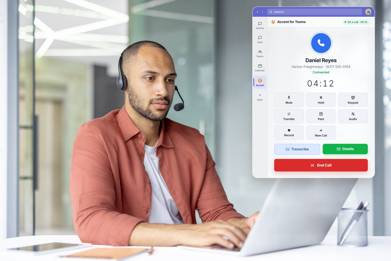 Man at a laptop next to an Accent for Teams active call